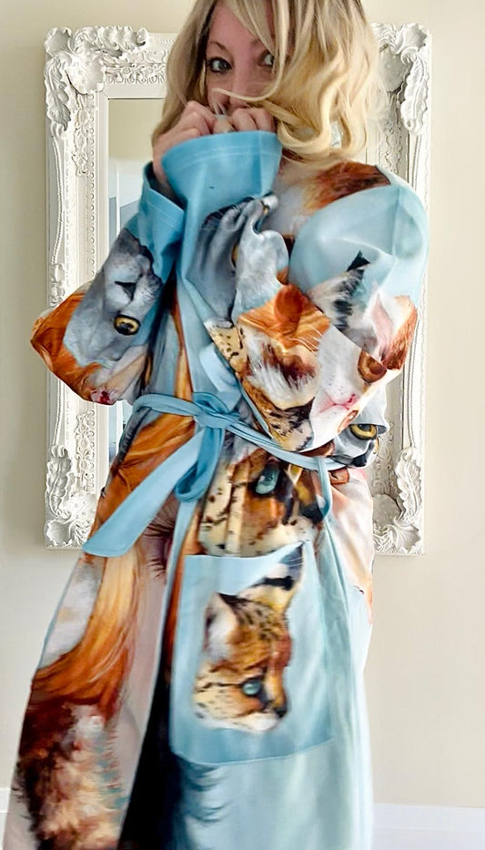 Woman wearing a robe with cat print design 