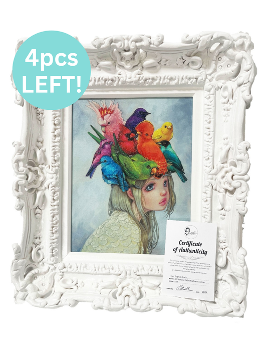 Framed artwork with colorful birds on a woman's head, displayed in a decorative white frame.
